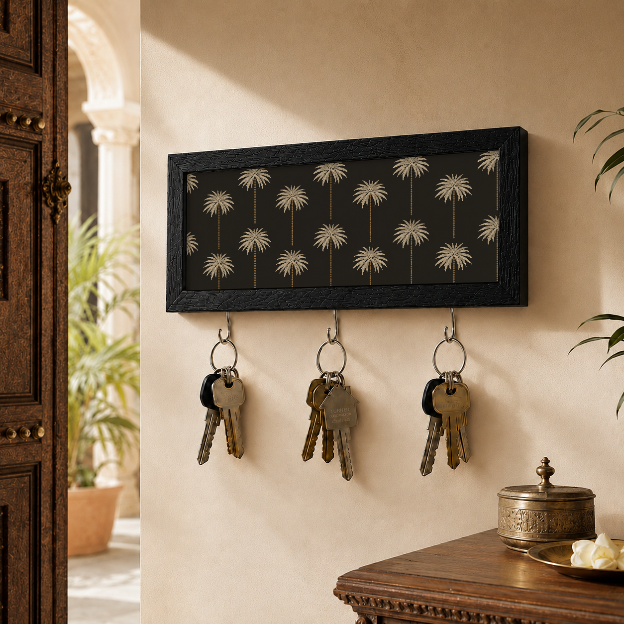 Key holder with keys attached to a wall in a home setting