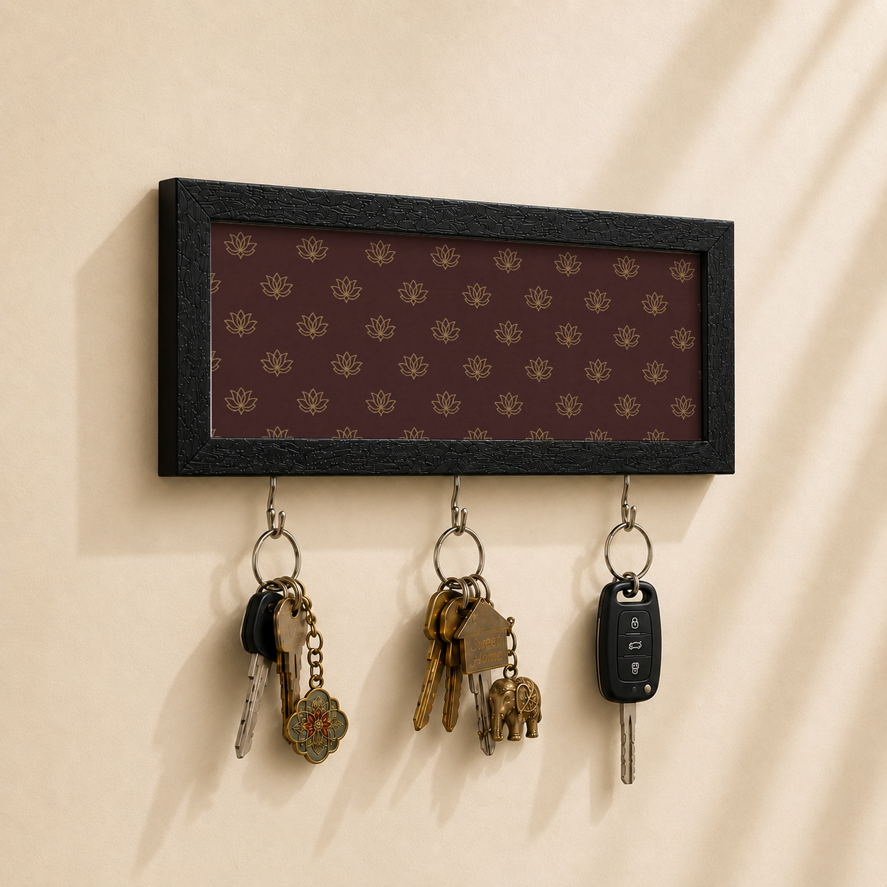 Key holder with elephant design on a beige wall