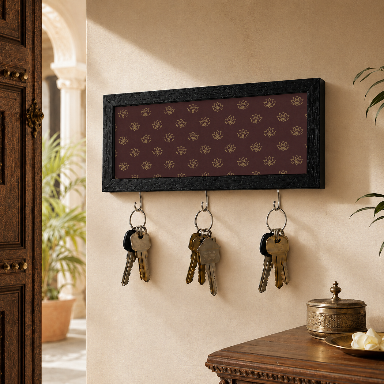 Key holder with keys attached to a wall in a home setting