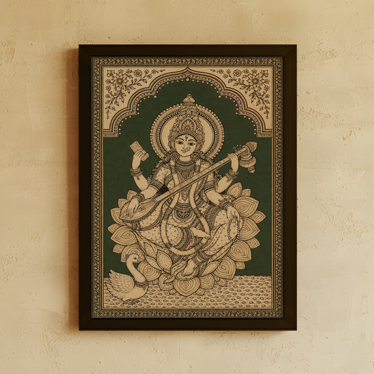 A framed Indian folk art print of Goddess Saraswathi seated on a lotus, displayed on a textured beige wall.