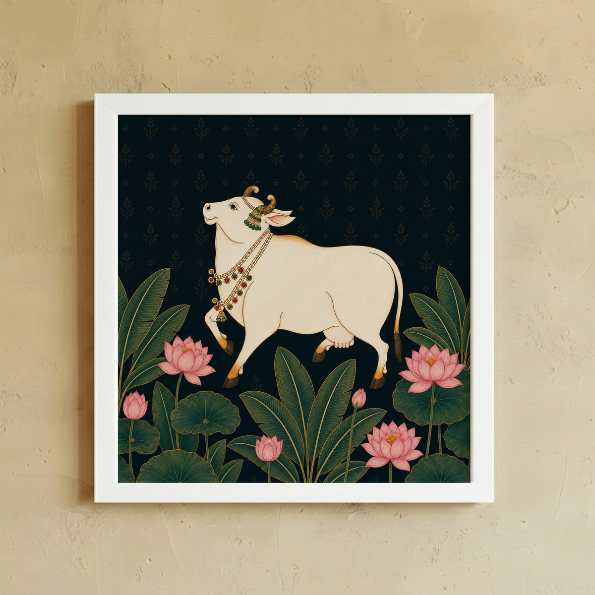 A framed art print featuring a hand with white flowers and gold-toned jewelry against a muted sage green background, mounted on a textured beige wall.