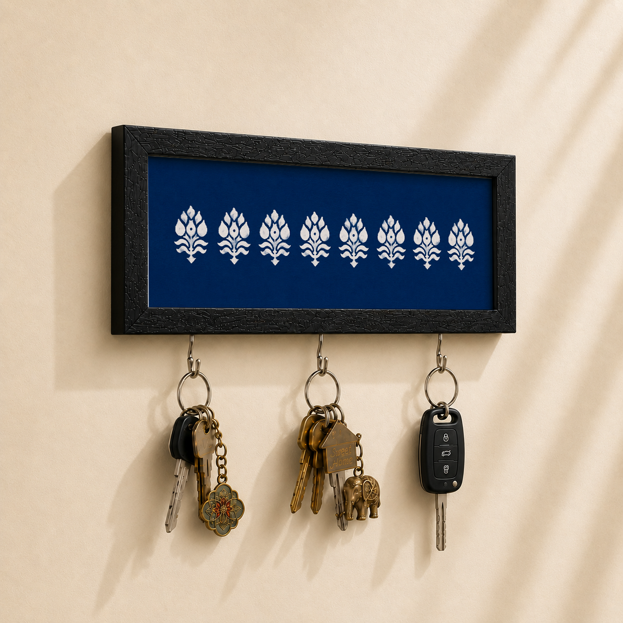 Navy Motif key holder from Purnam, angled view