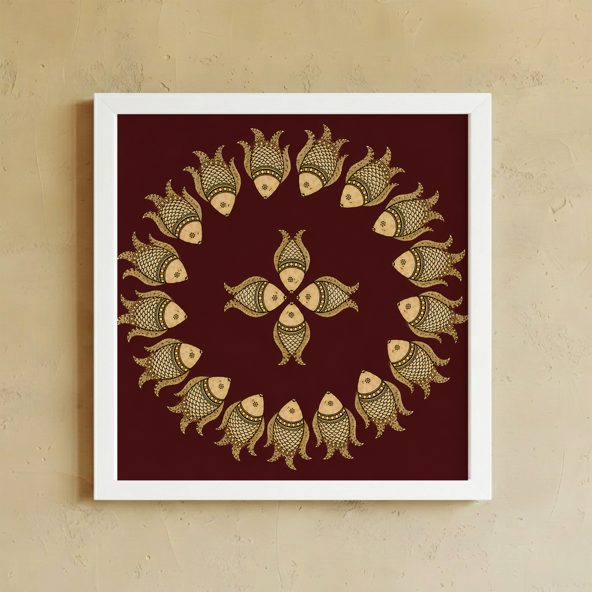 Framed wall art featuring a circular arrangement of stylized fish motifs in beige and brown on a deep maroon background, displayed against a textured beige wall.