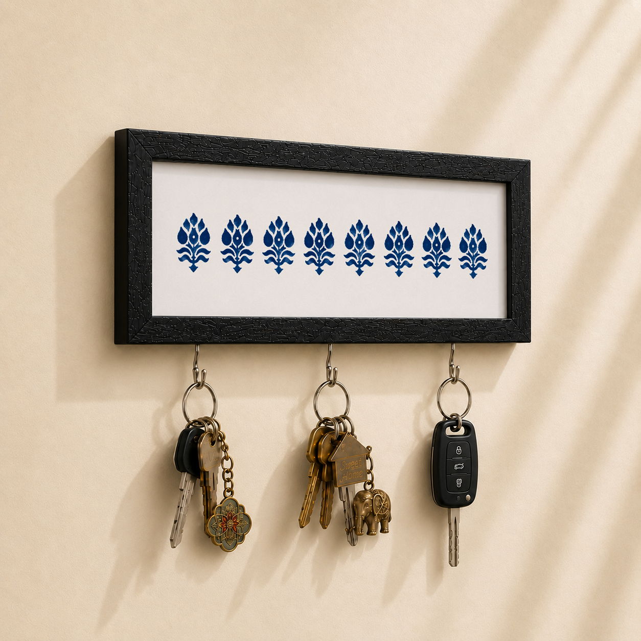White and Navy Motif key holder from Purnam, angled view