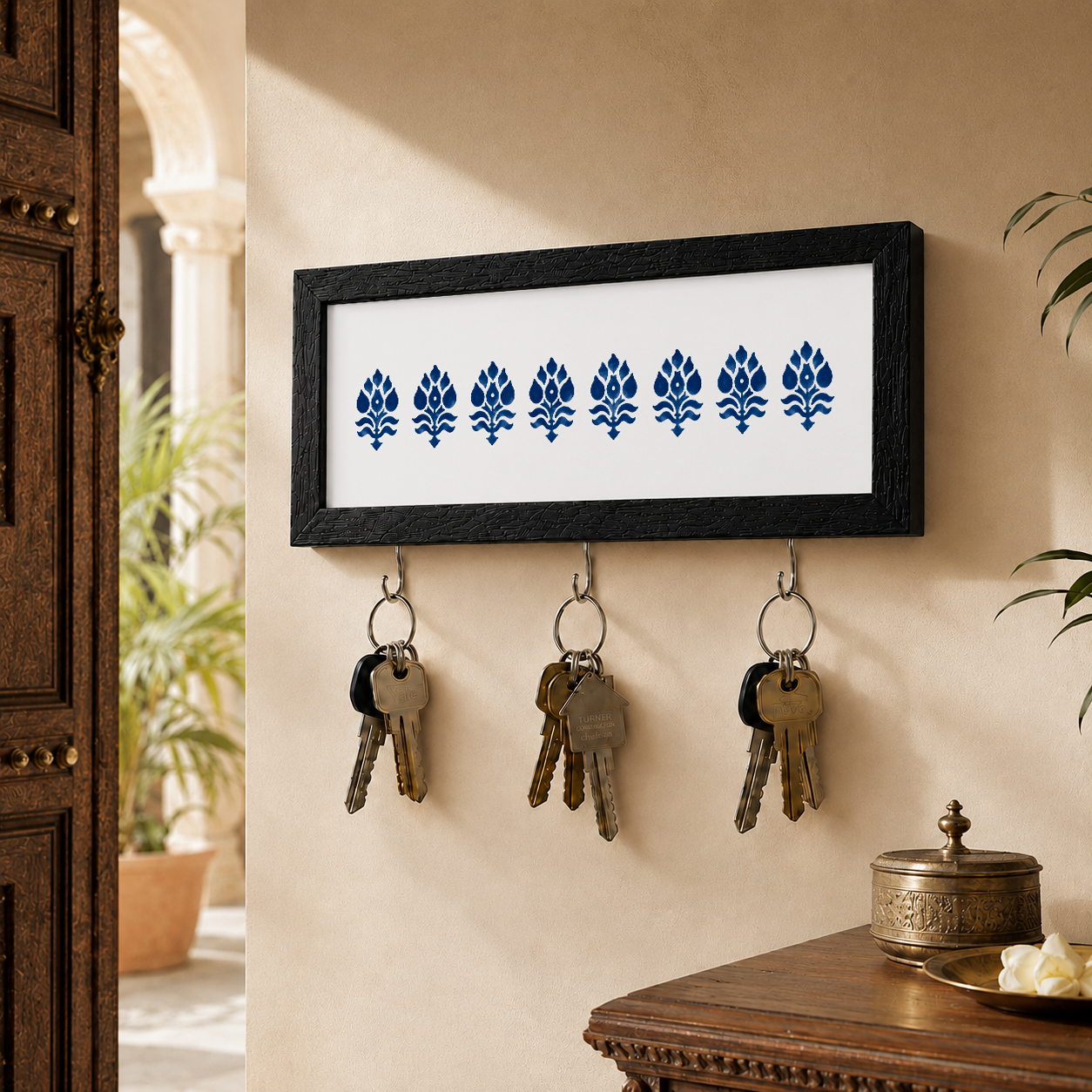 Close-up detail of the White and Navy Motif key holder from Purnam